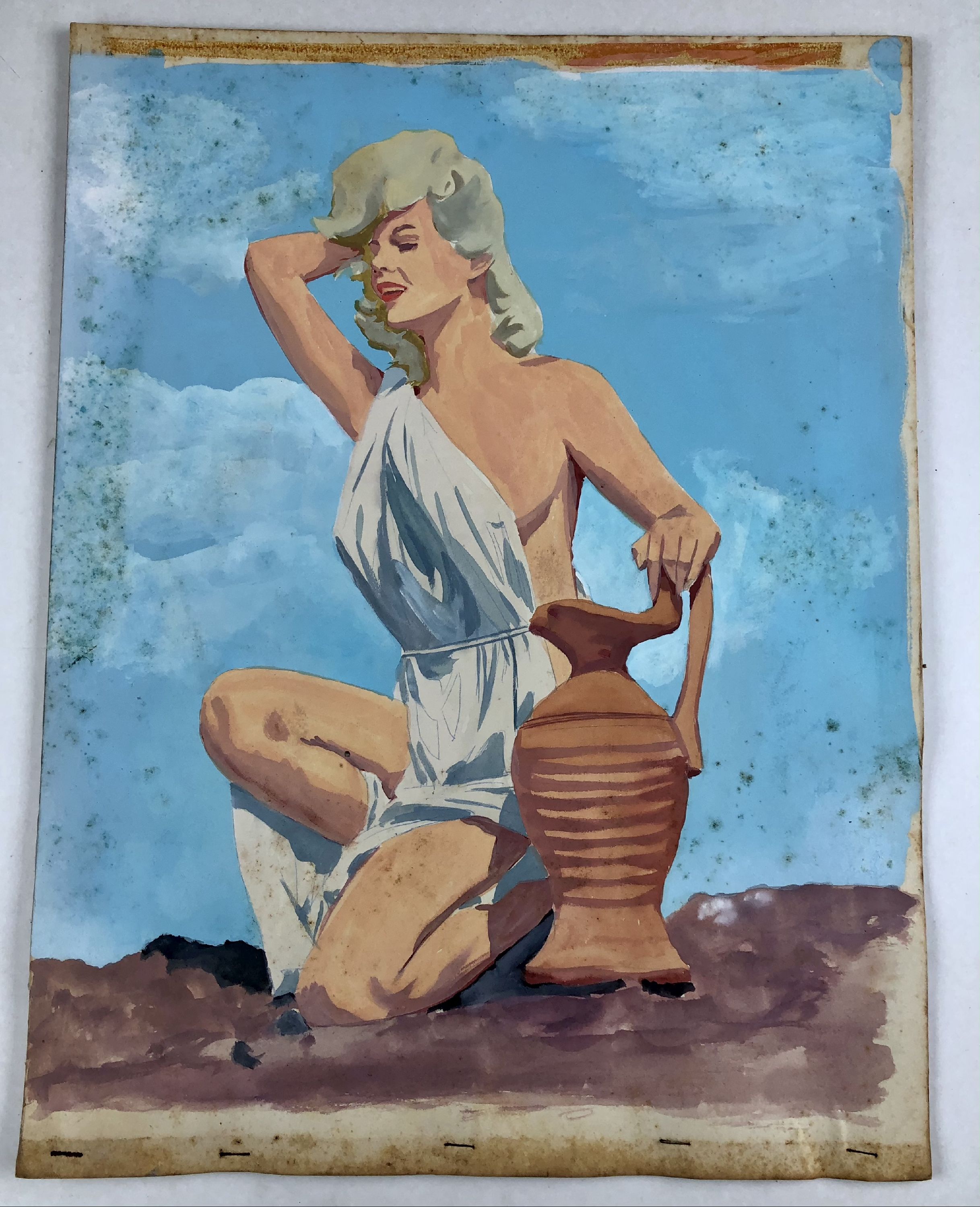 Bunny Yeager, in toga kneeling next to clay vase against blue sky (preliminary), foxing on surface
