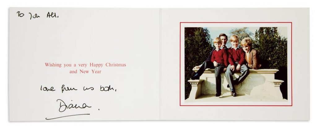 A Christmas card from Princess Diana featuring a photograph of the royal family which includes a young William and Harry.