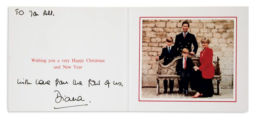 A Christmas card from Princess Diana featuring a photograph of the royal family which includes a young William and Harry.
