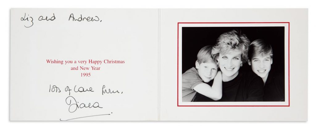 A Christmas card from Princess Diana featuring a photograph of the royal family which includes a young William and Harry.