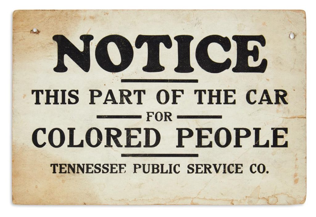 Tennessee Jim Crow era bus sign reading "Notice: This Part of the Car for Colored People"