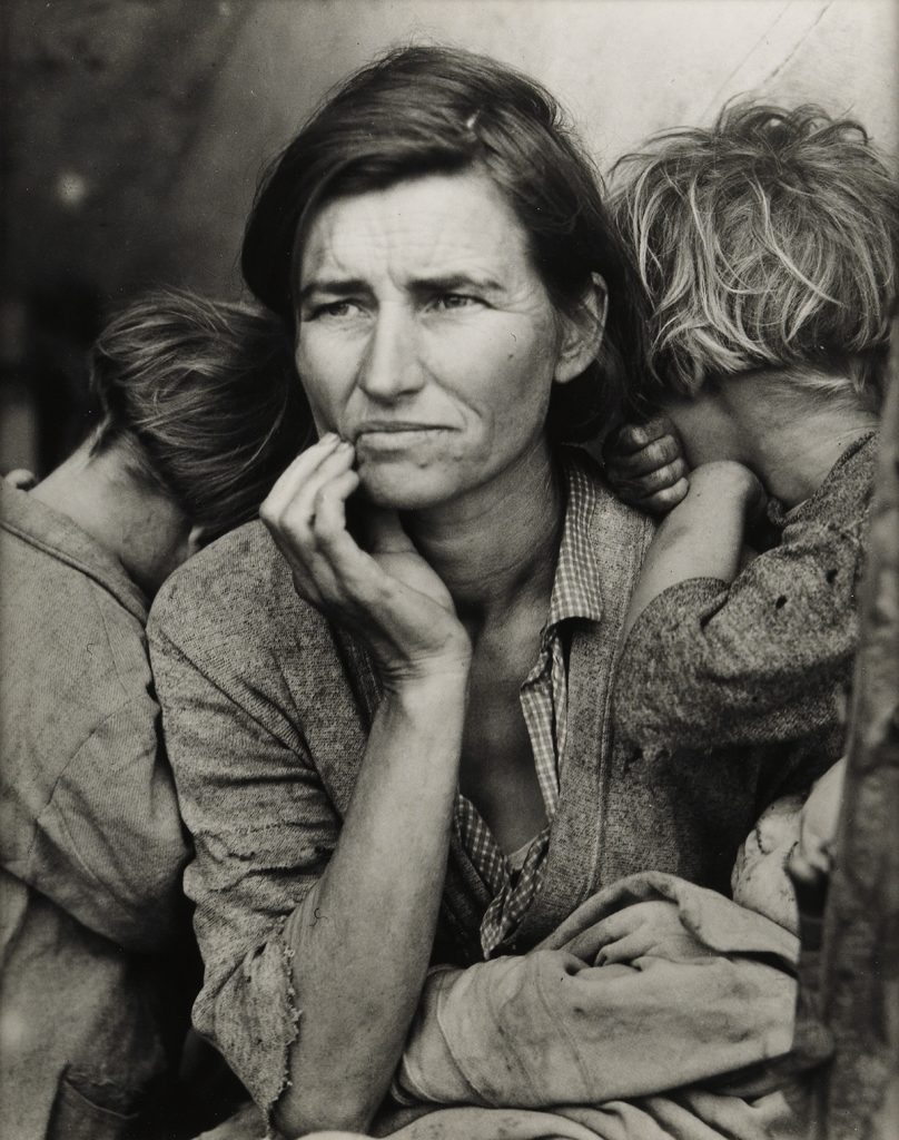 Black and white photographic portrait of a migrant mother by Dorothea Lange.