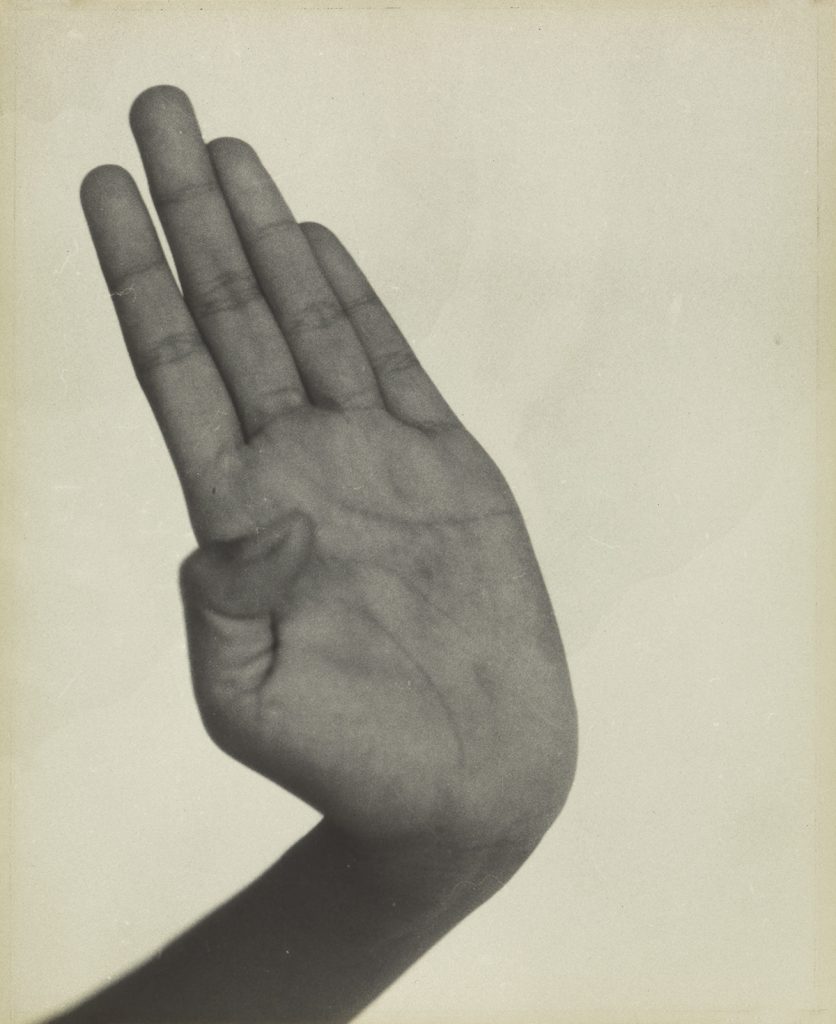 Photograph of a hang by Dorothea Lange.