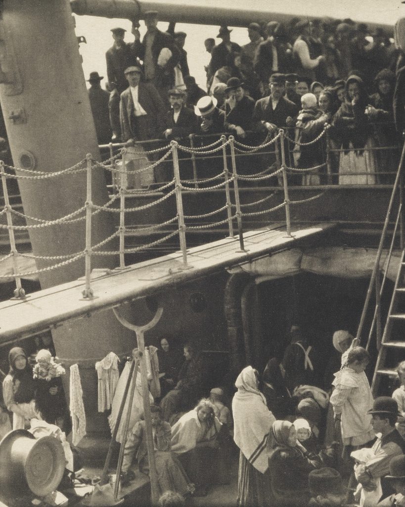 Sepia toned image of immigrants onboard a boat from 1911 by Alfred Stieglitz.